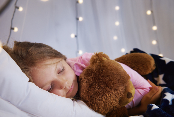 girl-sleeping-with-teddy-bear-her-bedroom